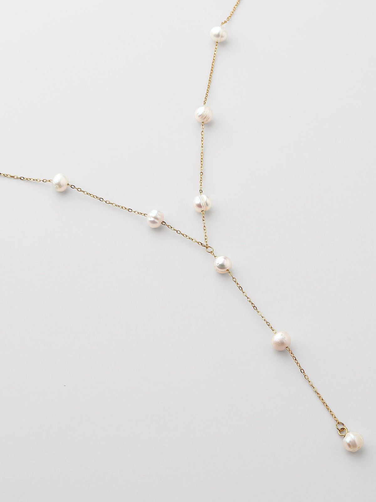 Collar largo con perla Dorado