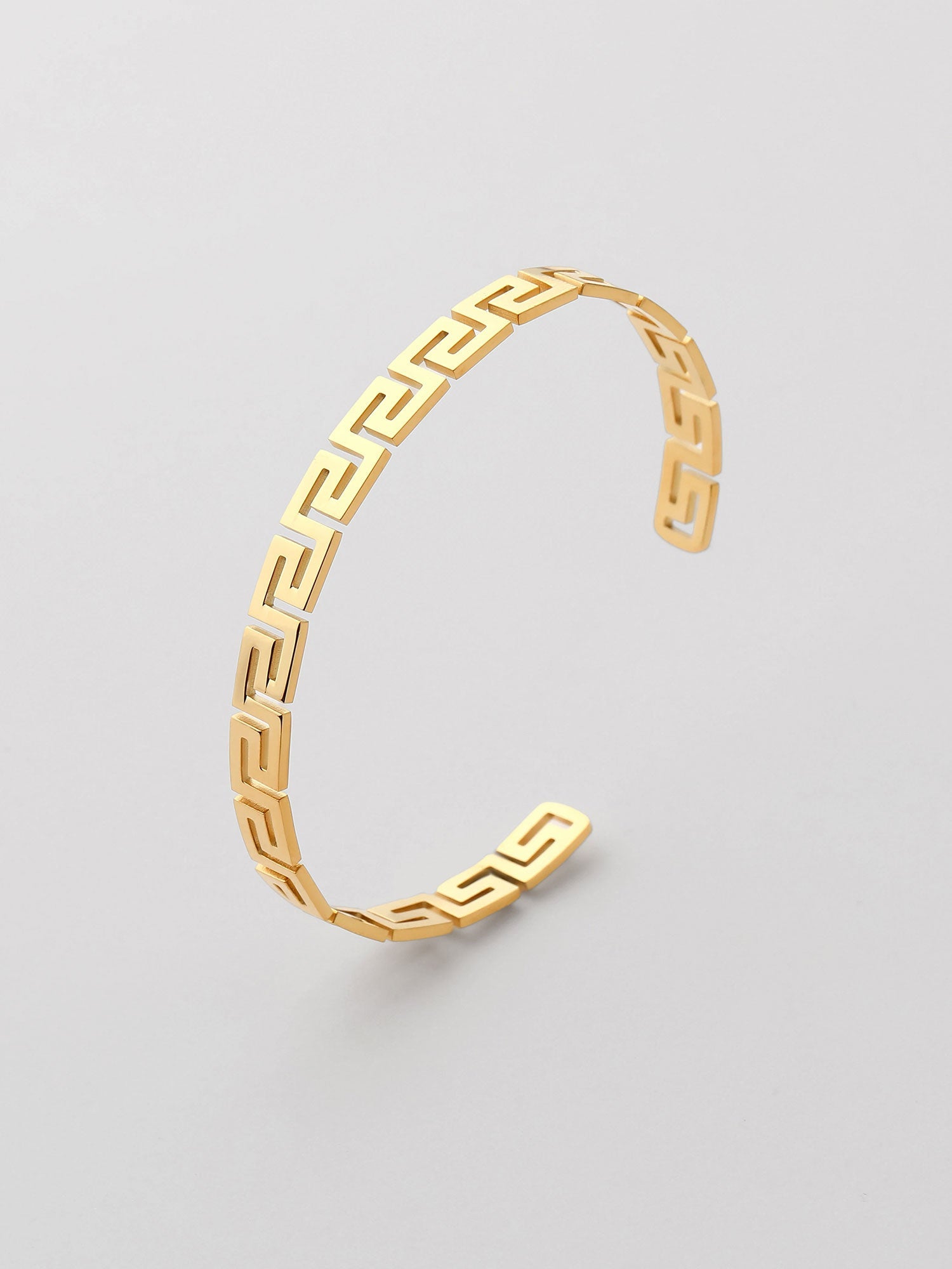 Brazalete abierto con forma geométrica Dorado