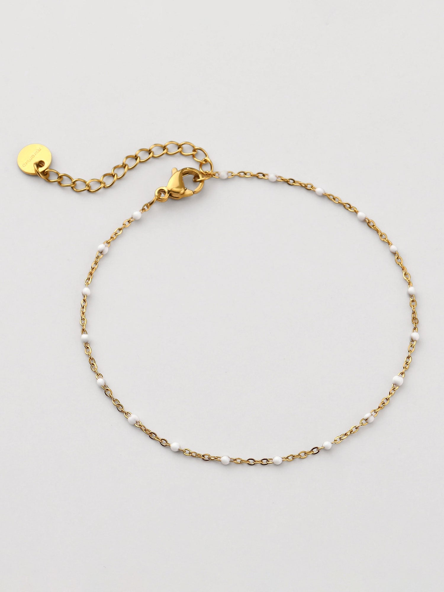 Pulsera con piedra natural blanca dorada