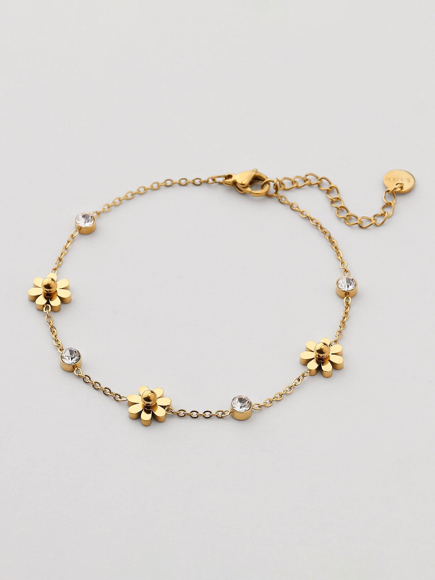Pulsera de flores con zirconias dorada