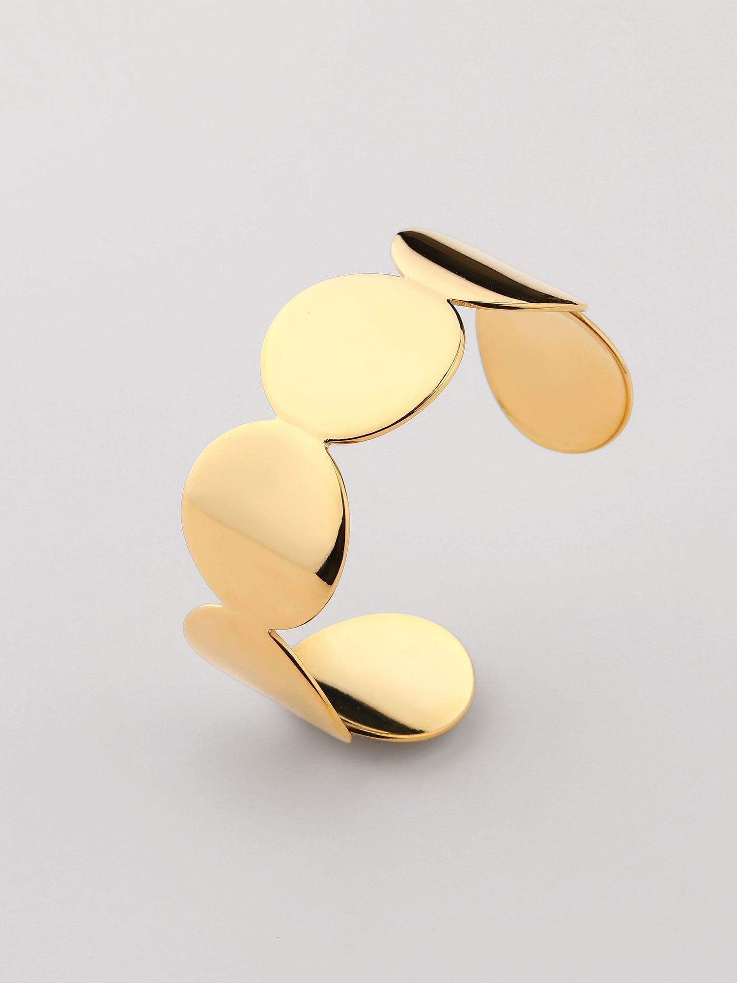 Brazalete abierto con cí­rculos Dorado