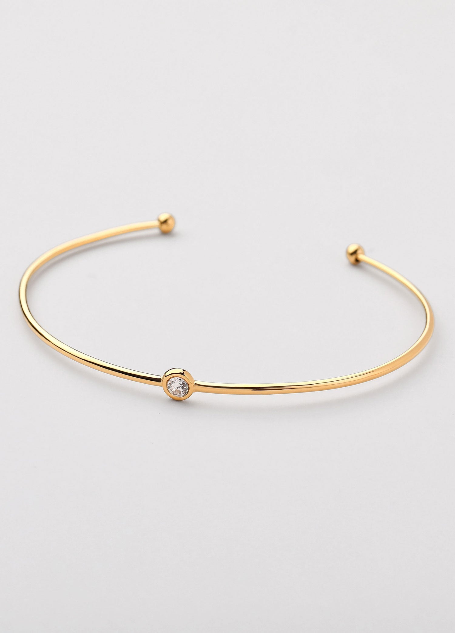Brazalete abierto con zirconia Dorado