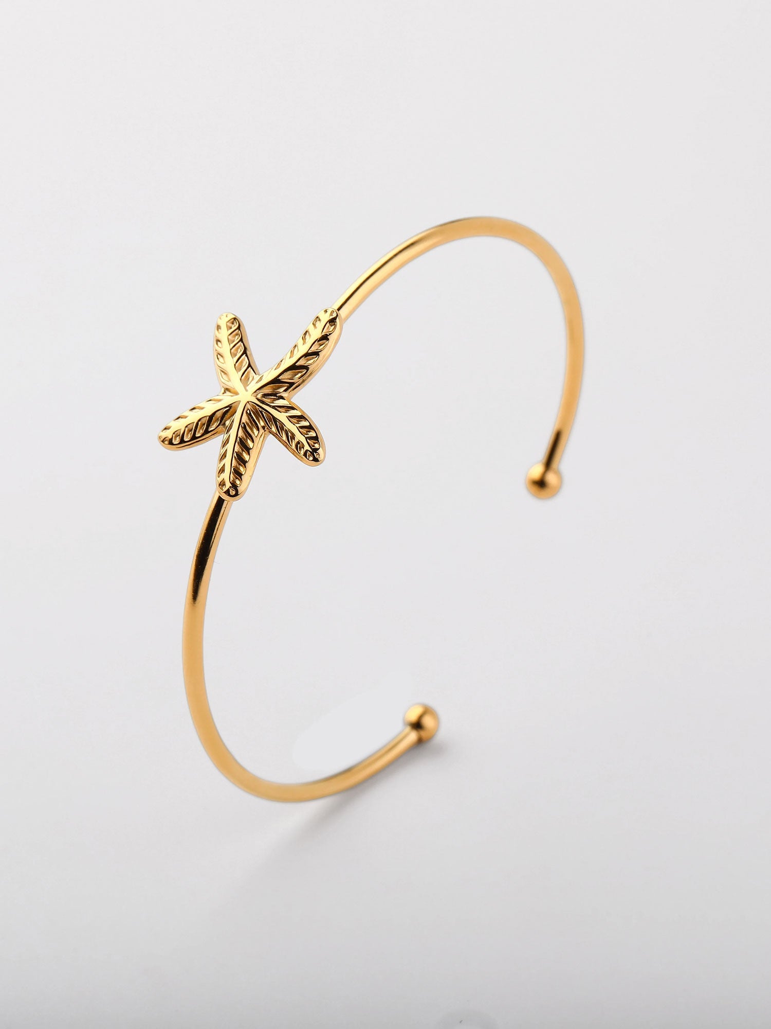 Brazalete abierto estrella de mar Dorado